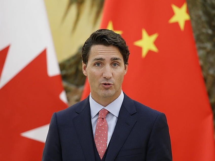 canada charges former undercover cop with aiding chinese persecution