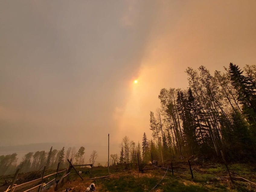 canada evacuates thousands as wildfires surge