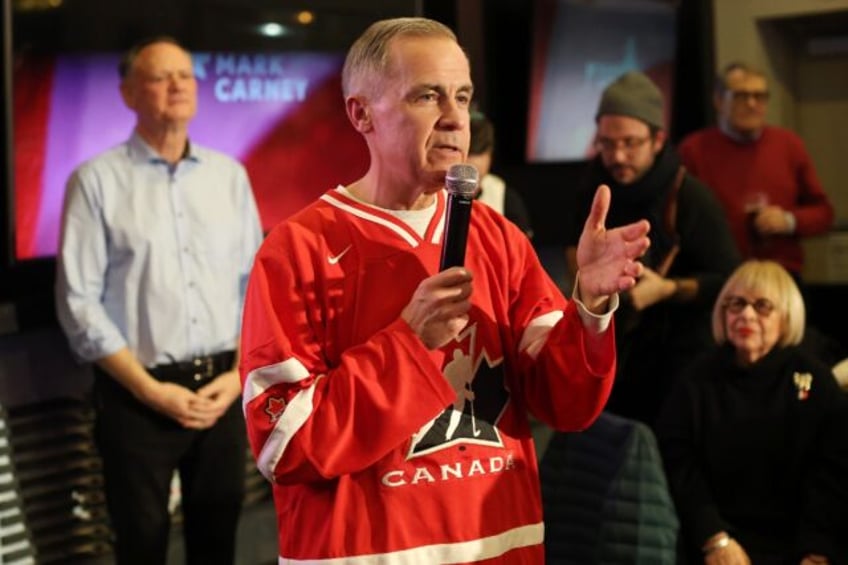 Canada's Liberal Party candidate Mark Carney speaks to supporters at a hockey watch party