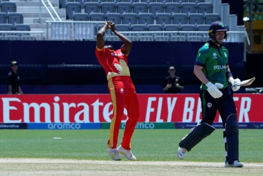 Key blow: Jeremy Gordon catches Mark Adair off his own bowling during Canada's 12-run T20