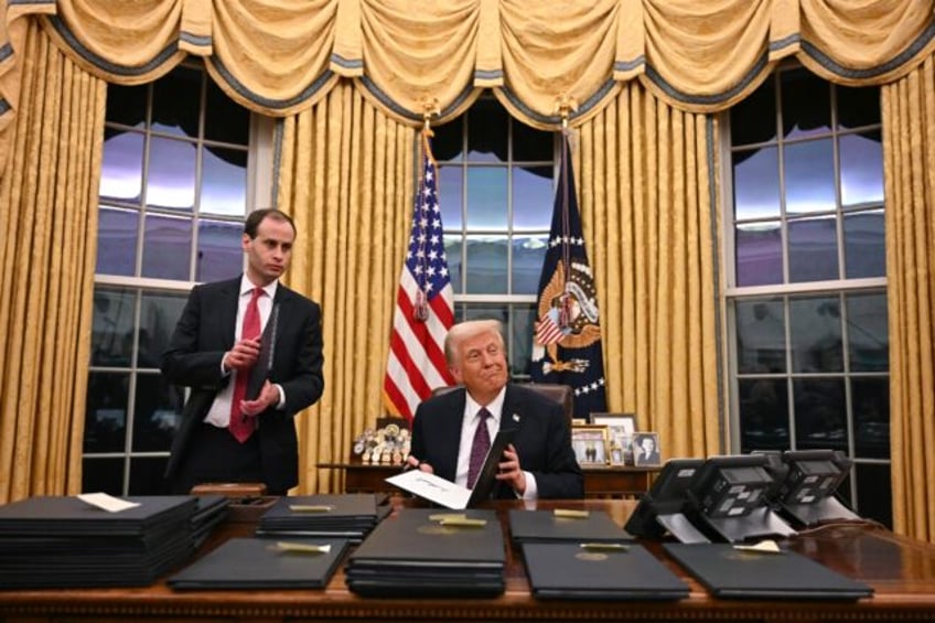 US President Donald Trump, shown here signing executive orders in the Oval Office on Janua