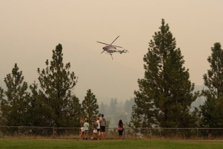 canada wildfires spread and merge as evacuations continue