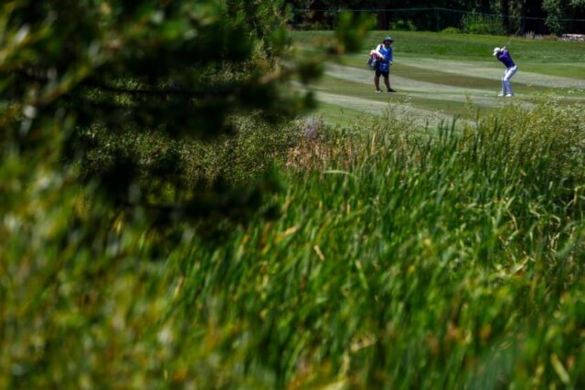 Canadian Ben Silverman hits an approach shot on the way to the first-round lead in the US