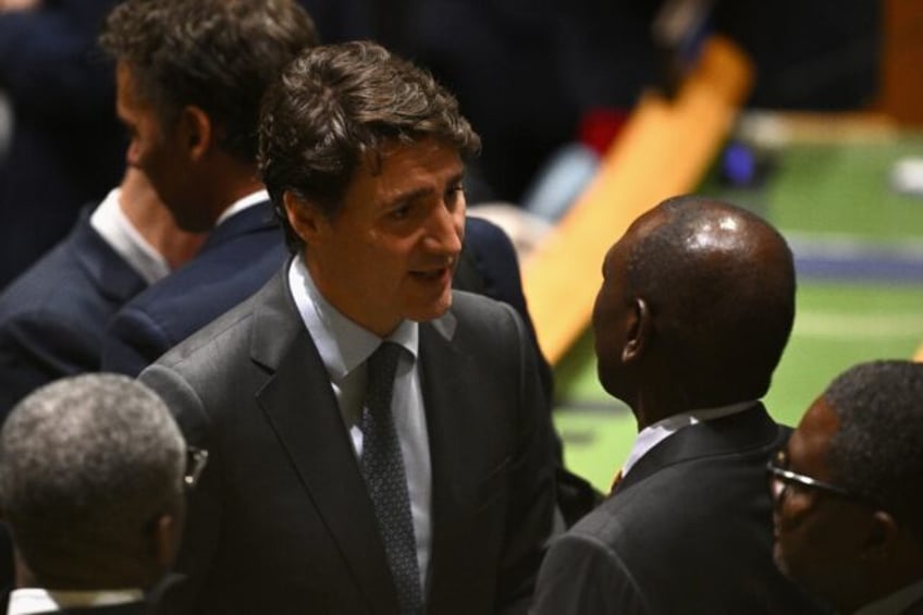 Canadian Prime Minister Justin Trudeau (L) attends the 79th Session of the United Nations