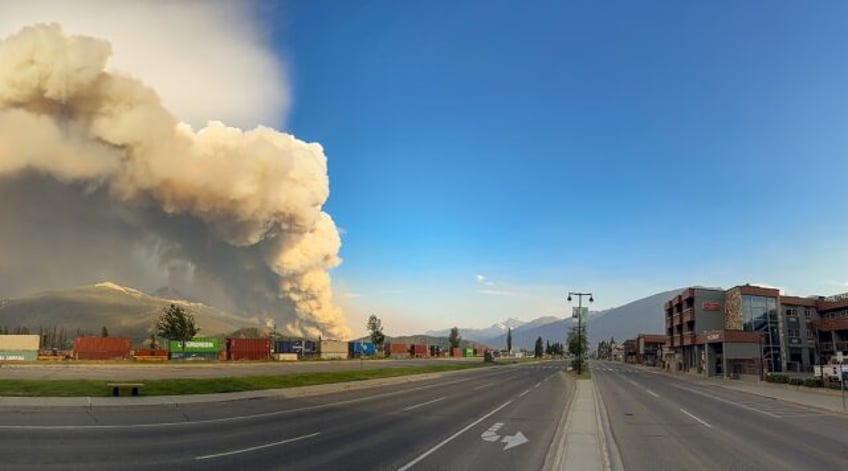 An image obtained from Jasper National Park shows smoke from a wildfire in July 2024