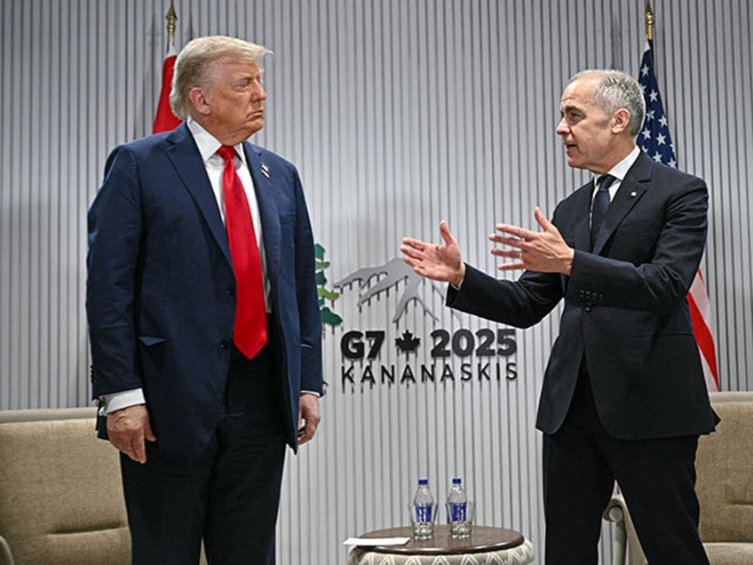US President Donald Trump looks on as Canadian Prime Minister Mark Carney (R) speaks as th