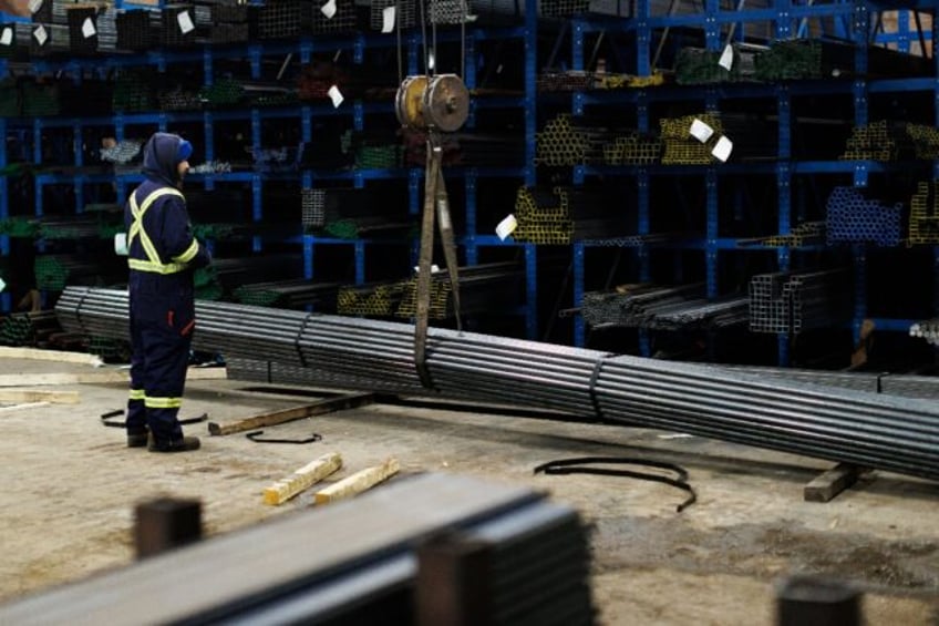 A worker moves steel product at North York Iron, a supplier in Toronto, where people have