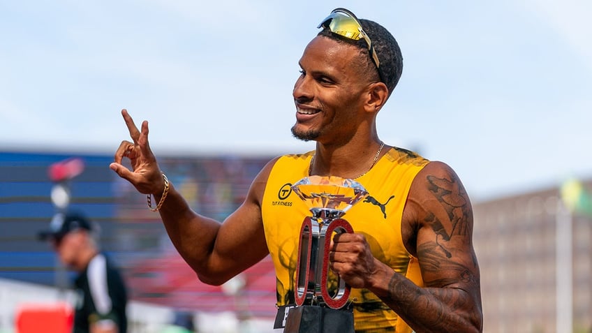 Andre De Grasse smiles