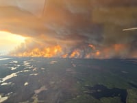 Canadian wildfire emergency spreads to second province