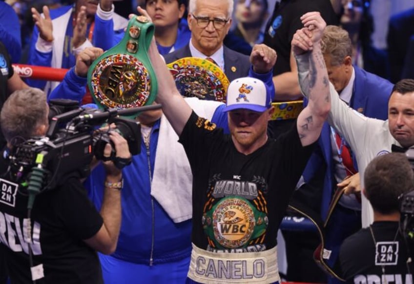 Mexico's Canelo Alvarez celebrates after wunifying the super middleweight titles against C