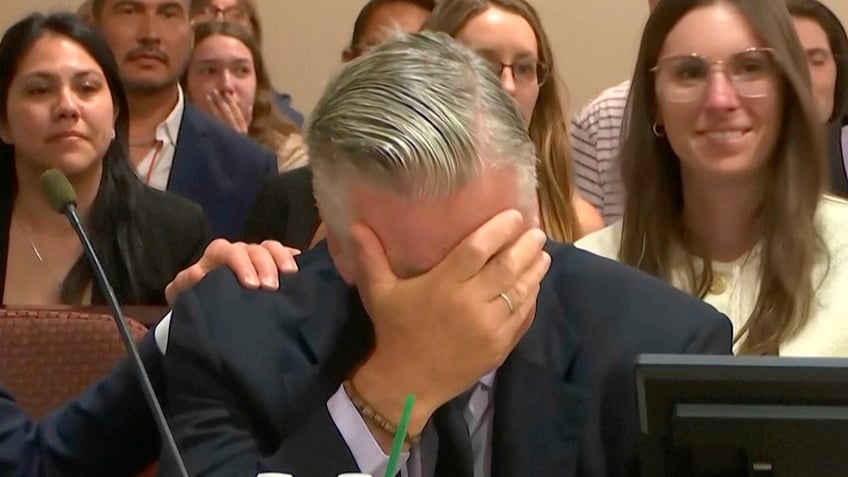 Alec Baldwin reacts after the judge threw out the involuntary manslaughter case