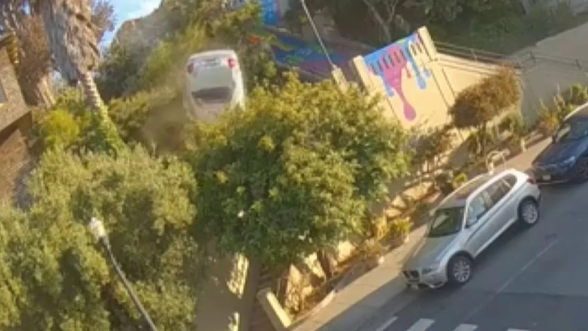 car drives off public stairway in san francisco flips through air onto tree in wild video