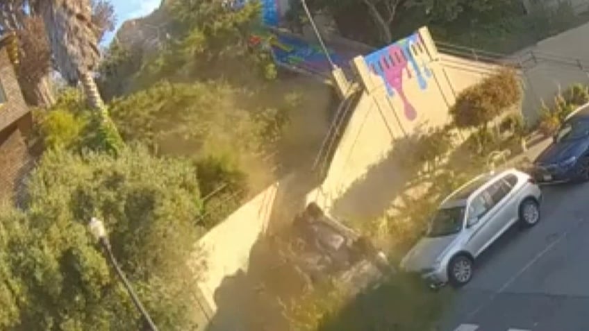 car drives off public stairway in san francisco flips through air onto tree in wild video