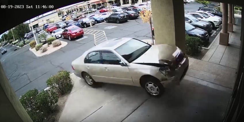 car smashes into arizona beauty salon narrowly missing customer video