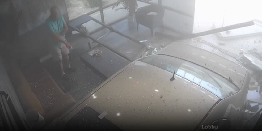 car smashes into arizona beauty salon narrowly missing customer video