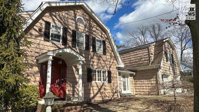 An exterior view of the front entrance of Joseph and Susana Landa’s home where squatter Brett Flores has taken over.