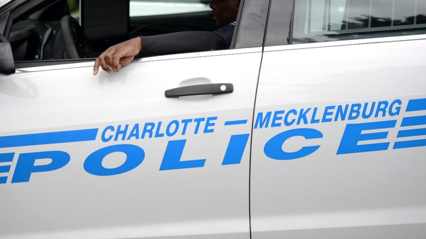 A Charlotte-Mecklenburg police officer is seen inside a patrol car ahead of Hurricane Florence in Charlotte, North Carolina, U.S., on Thursday, Sept. 13, 2018.