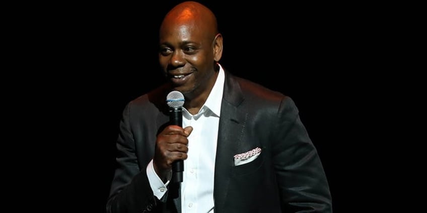 carlos santana declares a woman is a woman and a man is a man at concert defends dave chappelle