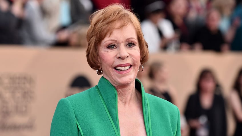 Close up of Carol Burnett in green