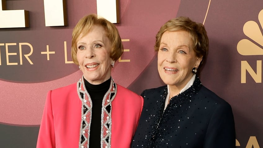 Carol Burnett in pink jacket and Julie Andrews in blue jacket at Carol Burnett event