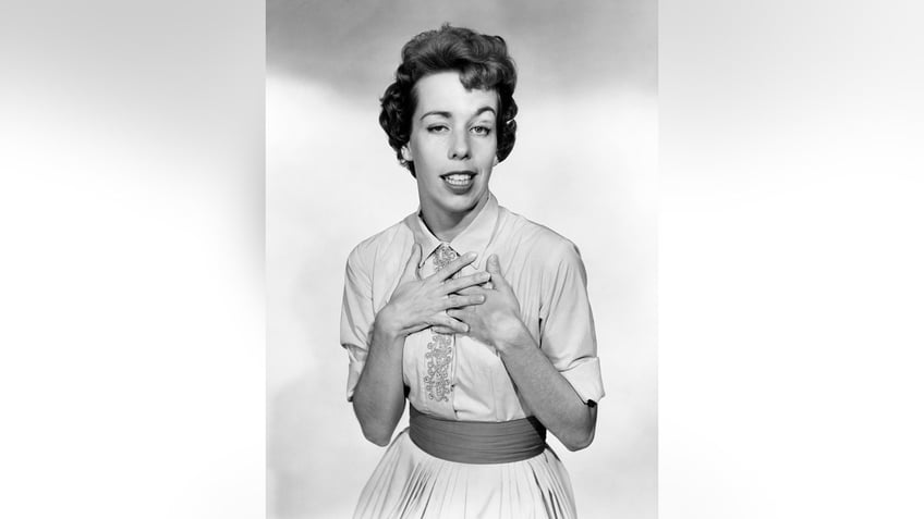A black and white photo of Carol Burnett making a funny face