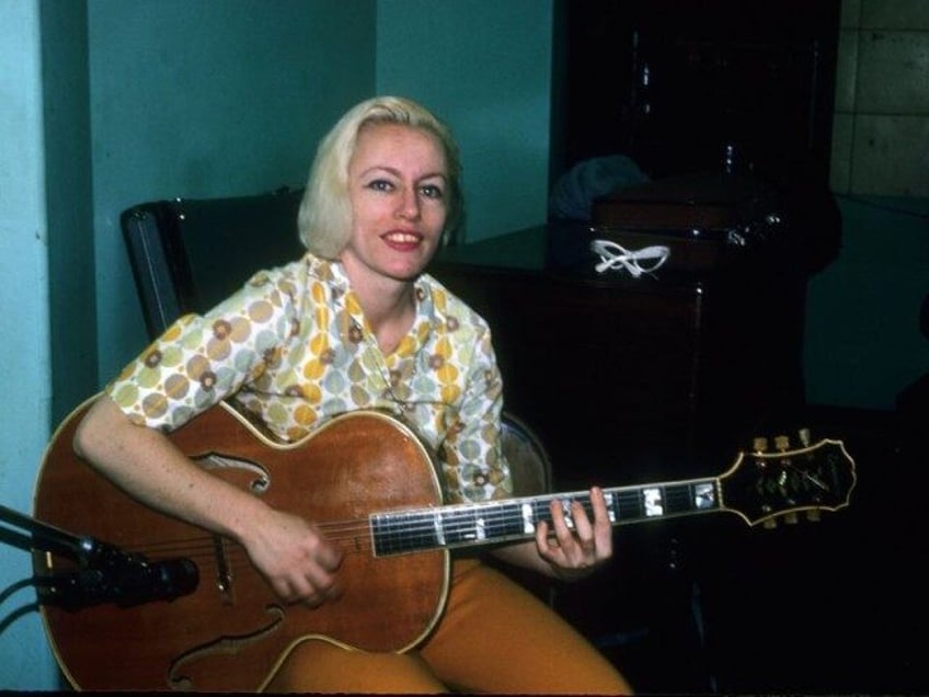 Bassist Carol Kaye plays an Epiphone hollowbody electric guitar in April 1966 in Los Angel