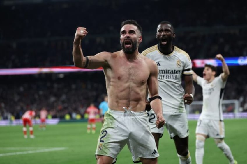 Real Madrid defender Dani Carvajal celebrates scoring his team's third goal to snatch victory in stoppage time against Almeria