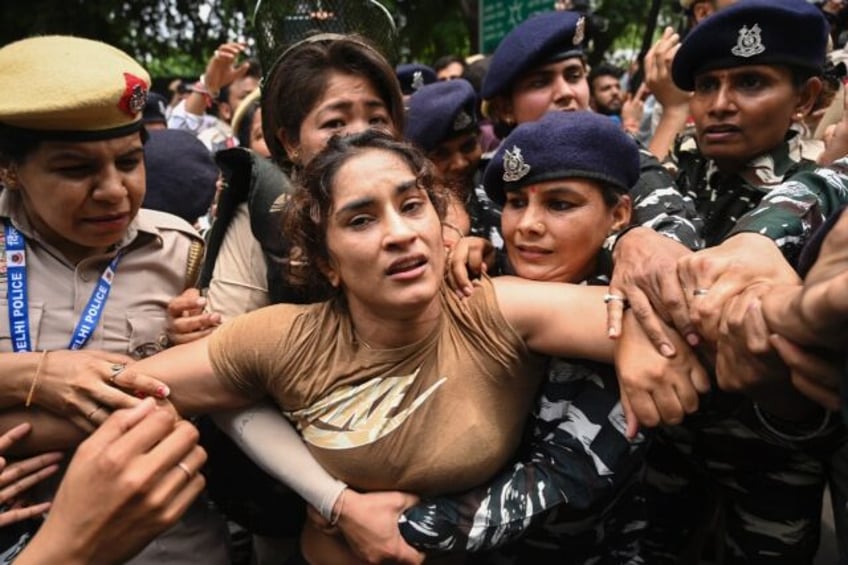 Wrestler Vinesh Phogat (centre) was last year part of a long-running protest against the t