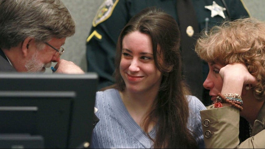 Anthony smiles at her attorney Mason before sentencing at the Orange County Courthouse in Orlando