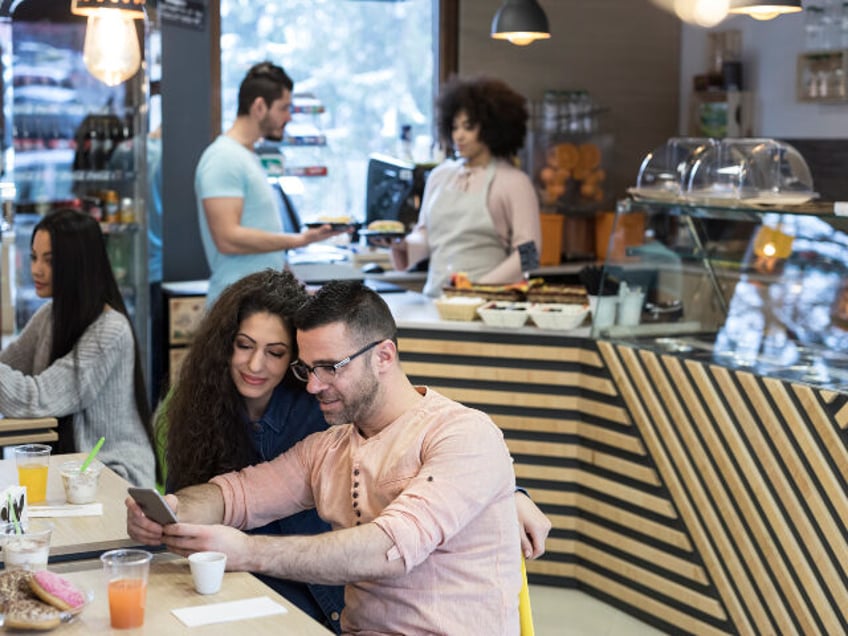 people in a cafe, donut store