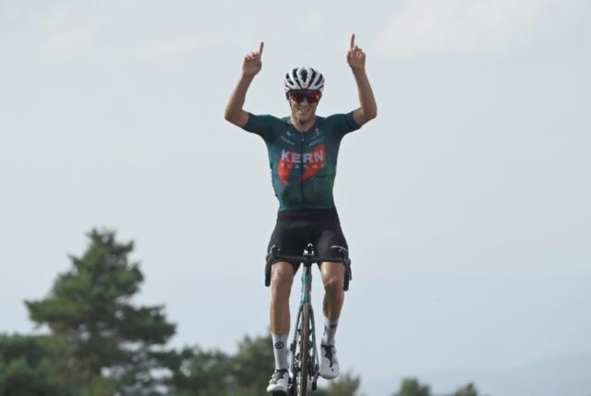 Pablo Castrillo points skywards as he wins on the Montana de Manzaneda