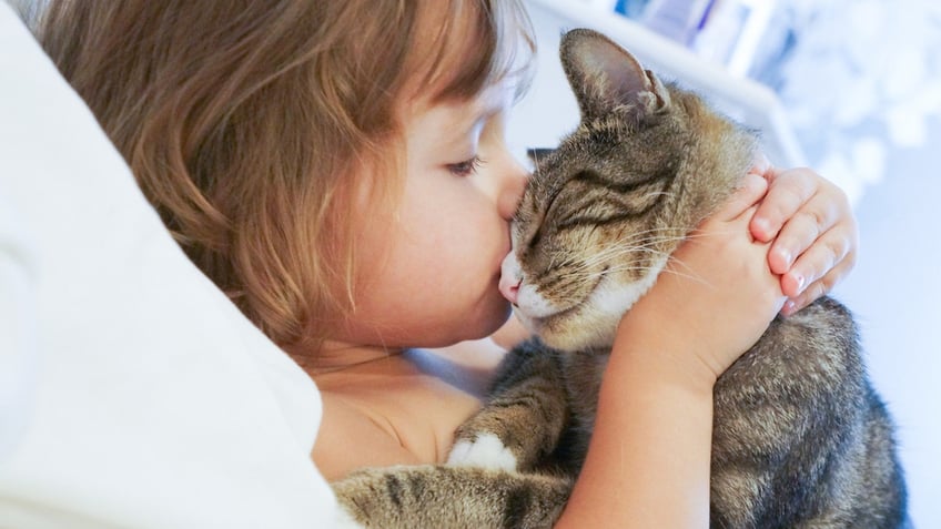 Young girl with cat