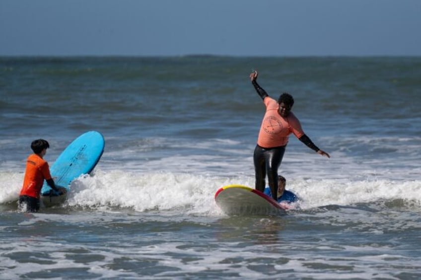 catching a break inner city californians try surfing