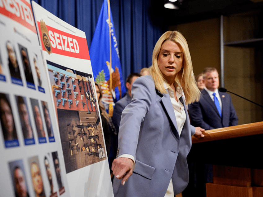 WASHINGTON, DC - MAY 6: U.S. Attorney General Pam Bondi points to a photograph of Heribert