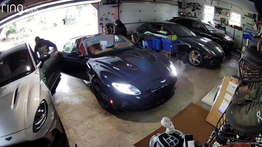 caught on cam masked carjackers attack aston martin driver in his own garage