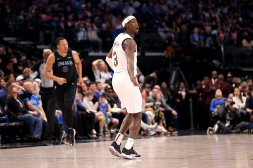 Cleveland's Caris LeVert reacts after making a three-point basket in the Cavaliers' NBA victory over the Dallas Mavericks