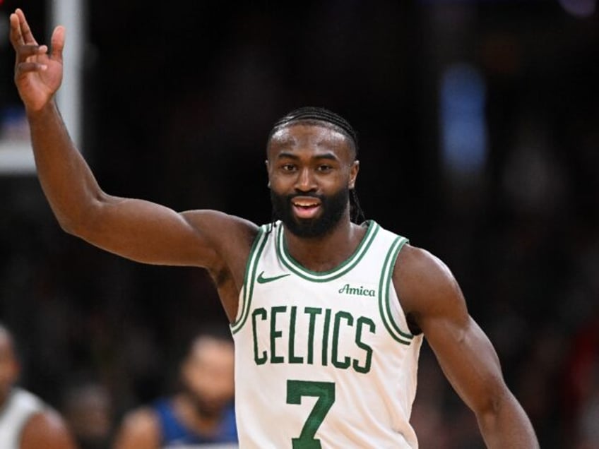 Boston's Jaylen Brown celebrates after sinking a 3-pointer in Boston's NBA victory over Mi