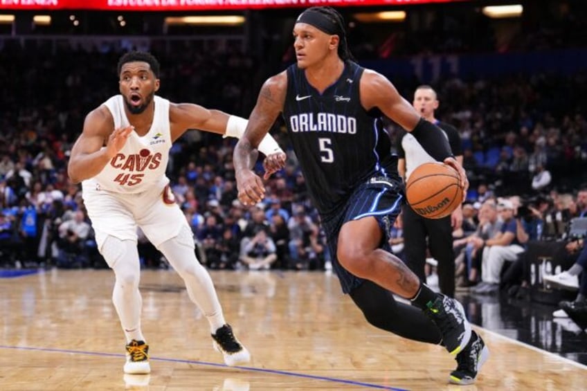 Orlando's Paolo Banchero (right) scored 24 points as the Magic halted Cleveland's 16-game