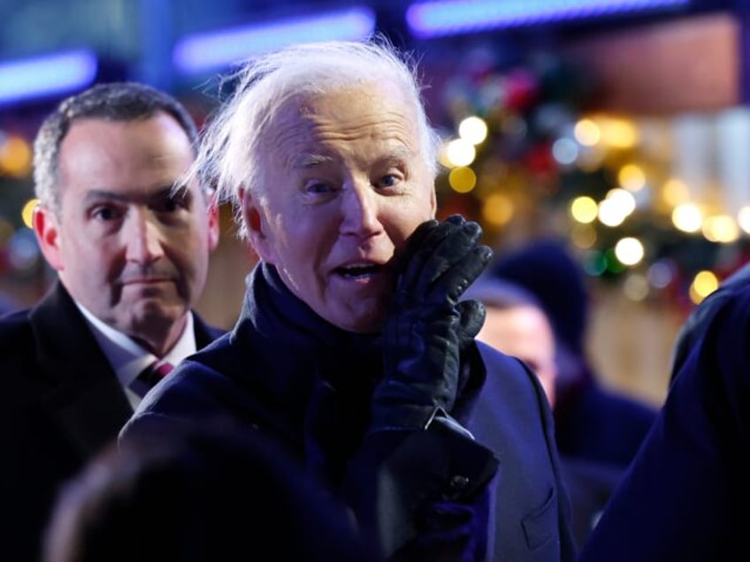 WASHINGTON, DC - DECEMBER 05: U.S. President Joe Biden yells out to the press while depart