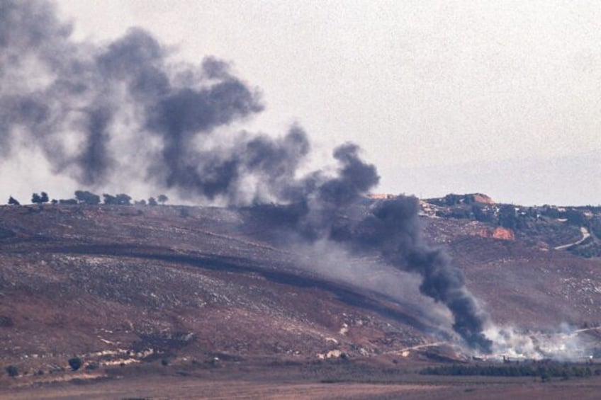 Smoke billows from the sites of an Israeli air strike in Lebanon's southern plain of Marje