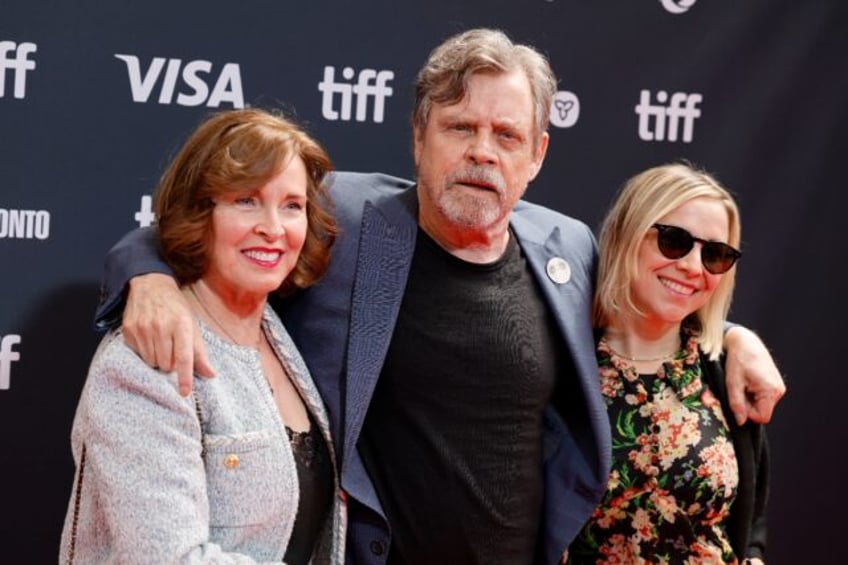 Marilou York and 'Star Wars' actor Mark Hamill (C) fled their Malibu home to escape a wild