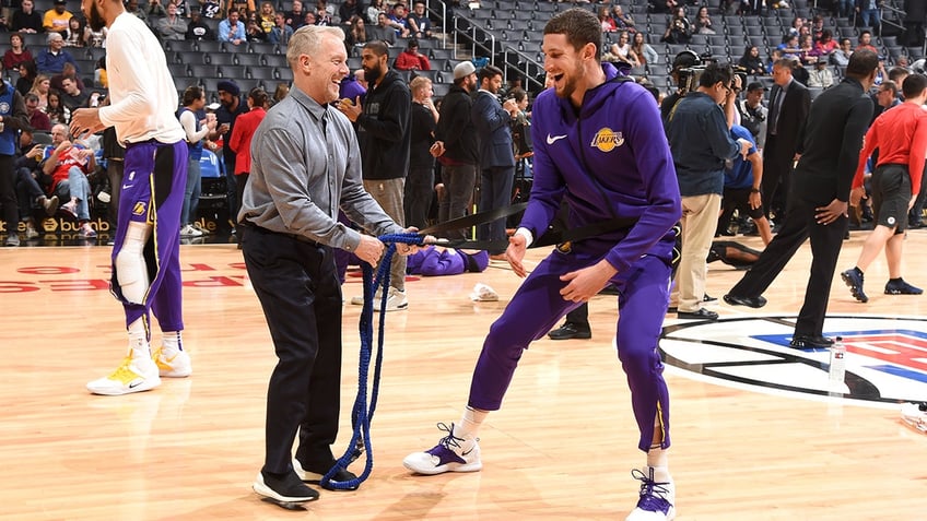 Mimke Muscala in purple trains with Gunnar Petterson in a grey shirt and black pants