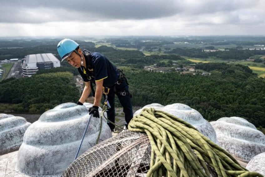 Each coil of curly hair on the giant Buddha statue is one metre wide