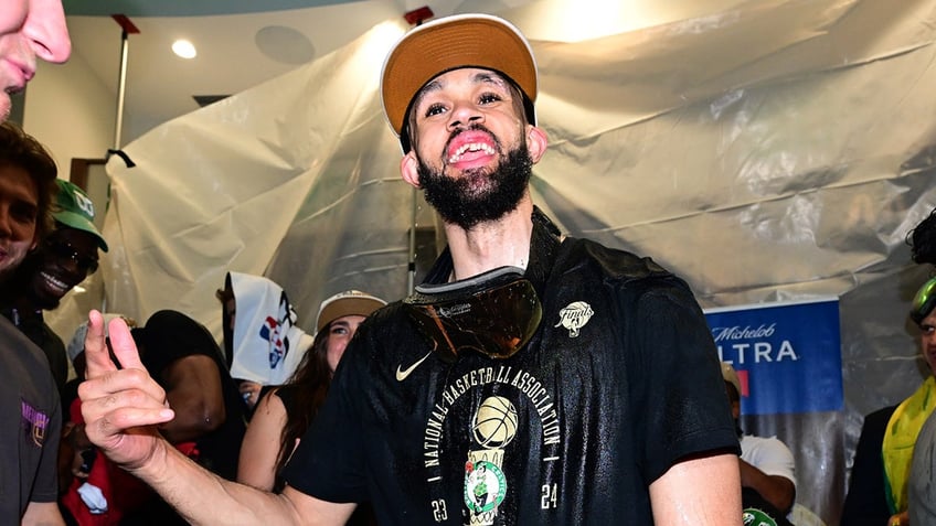 Derrick White celebrates