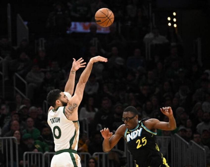 Jayson Tatum launches a three-pointer in Boston's win over Indiana on Tuesday