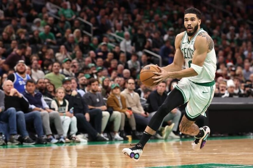 Boston's Jayson Tatum drives to the basket in the Celtics NBA overtime victory over the Minnesota Timberwolves