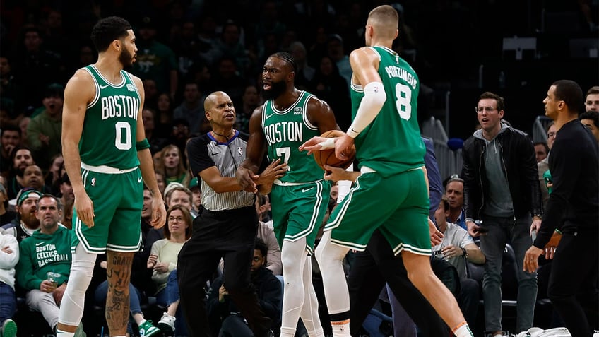 Jaylen Brown argues with a ref