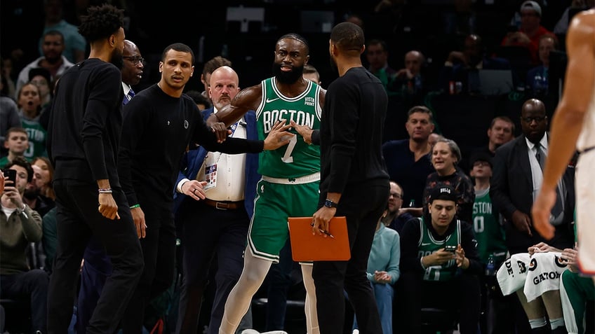 Jaylen Brown argues with a ref