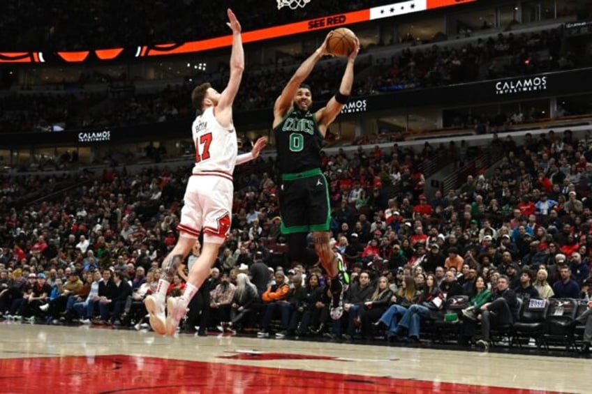 Boston's Jayson Tatum shoots over Onuralp Bitim in the Celtics' NBA victory over the Chica