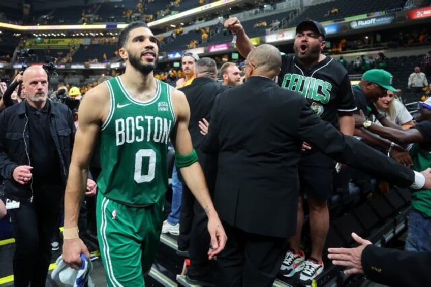 Boston's Jayson Tatum walks off the court after the Celtics' victory over the Indiana Pace